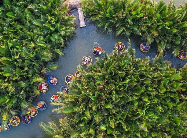 A group of people in boats in a river surrounded by trees AI-generated content may be incorrect.