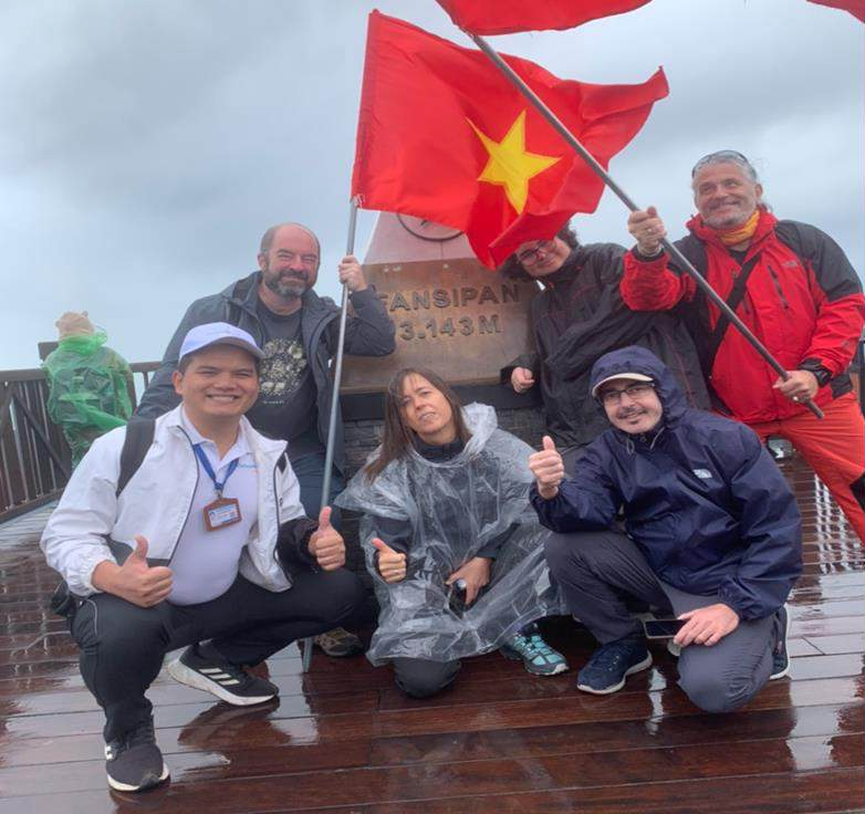 A group of people posing for a photo AI-generated content may be incorrect.
