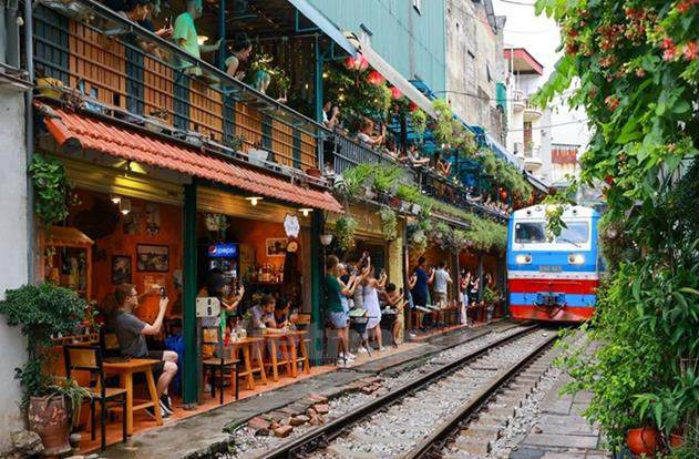 A train going down a street AI-generated content may be incorrect.
